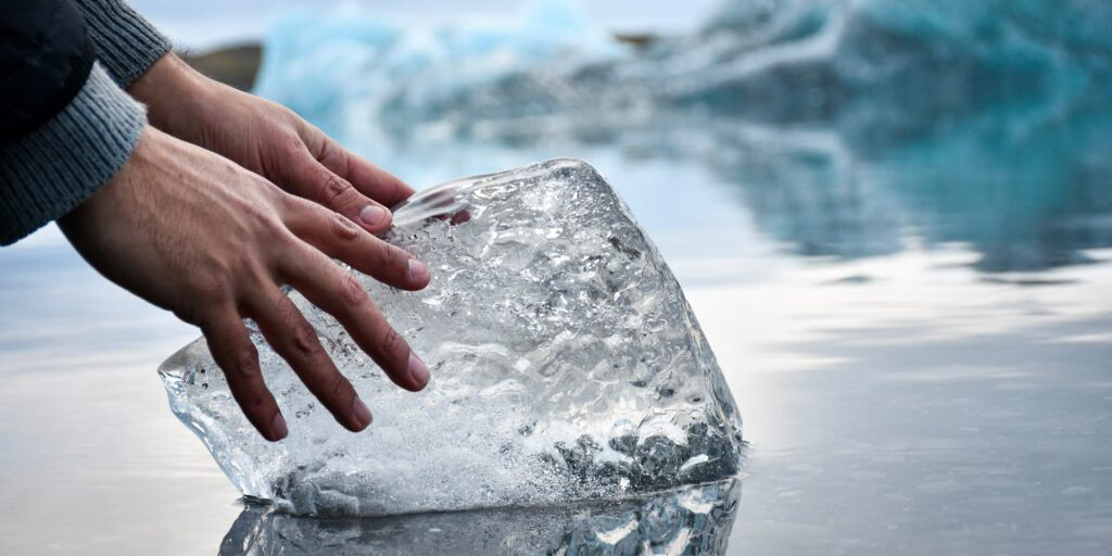 hands touching ice block benefits of ice baths